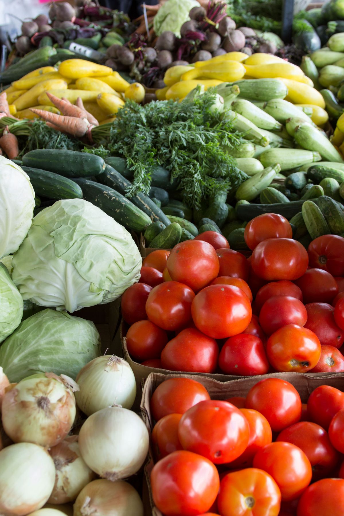 Fresh vegetables and produce arranged on a wooden surface