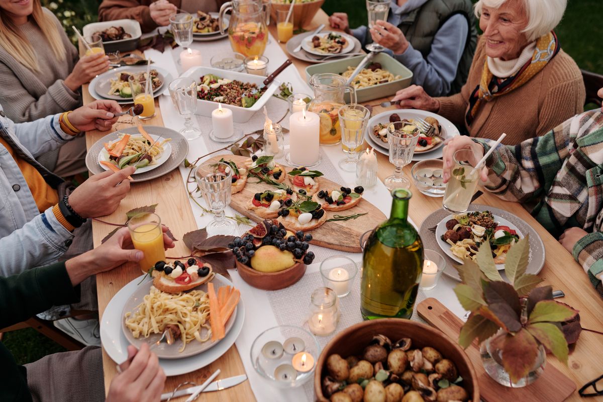 Group of people sharing a meal around a table