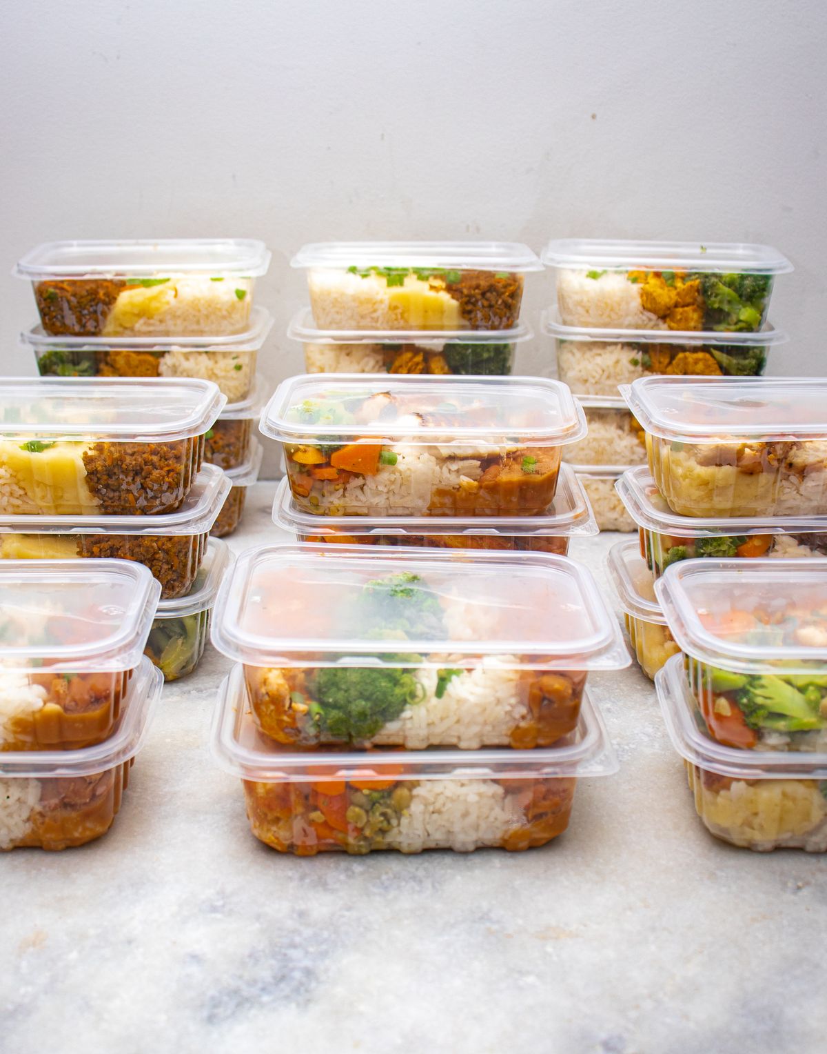 Meal-prep containers filled with rice and vegetables
