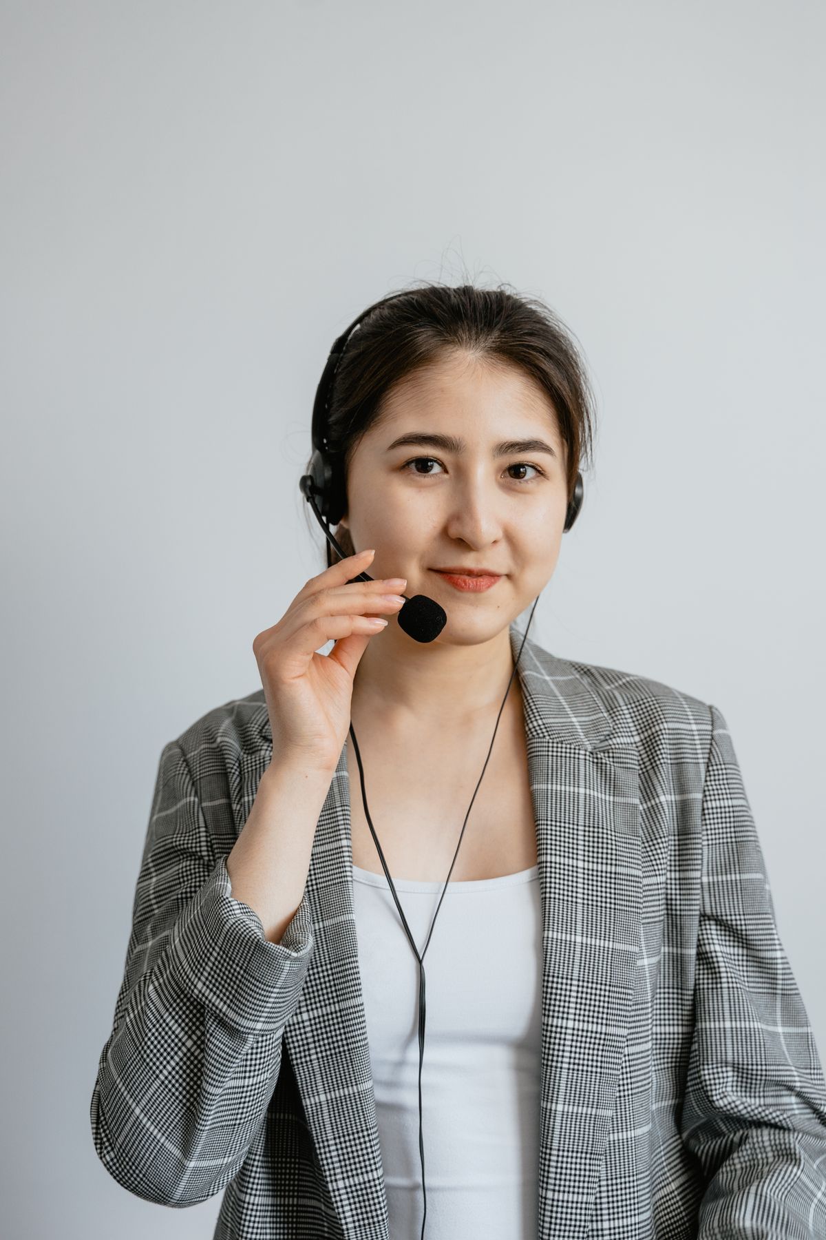 Person making a phone call while holding a takeaway bag