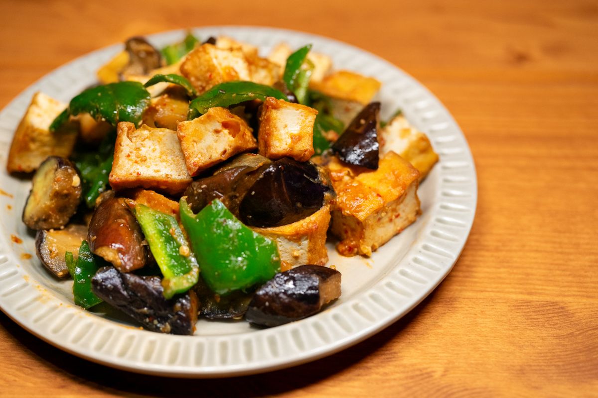 Stir-fried tofu with vegetables served on a plate